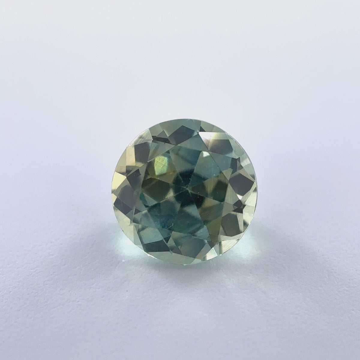 .56ct Parti-Color Round Cut Montana Sapphire 5mm x 3mm